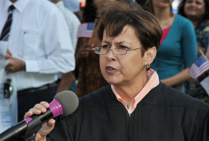 At these ceremonies, Judges ask new citizens to participate in democracy. 