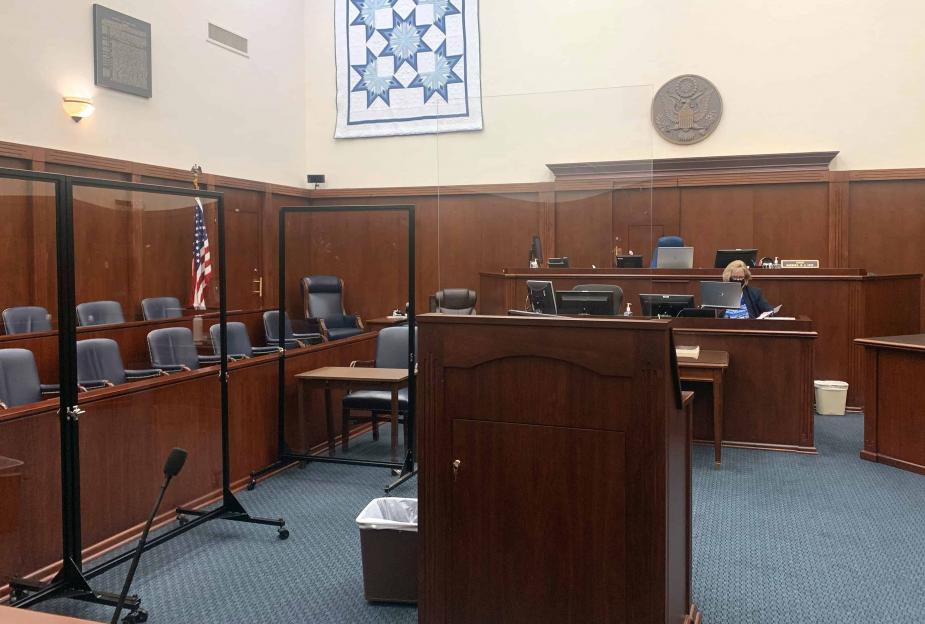 Court reporter Deborah Kriegshauser wore a mask and sat behind a plexiglass shield during the proceedings.