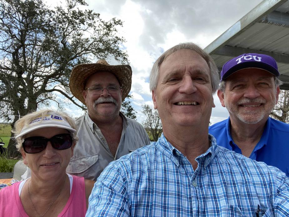 Chief Judge S. Maurice “Maury” Hicks after delivering an electrical generator and relief supplies purchased through court staff donations. Also in photo are Court Security Officer Malcom Hebert and his wife, Laurie, foreground, whose