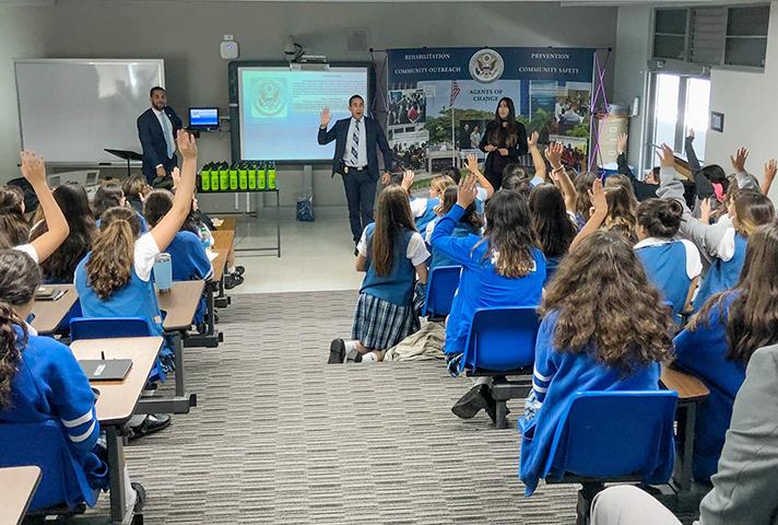 Image: Probation officers in Puerto Rico discuss probation's role in the courts with students.